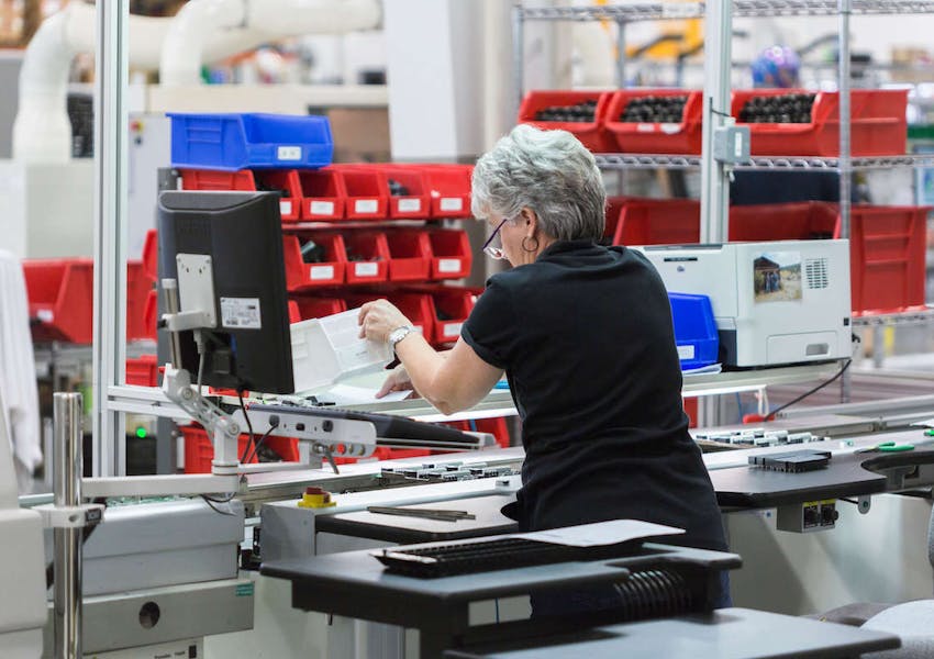 A DMP employee fulfills an order for a dealer.